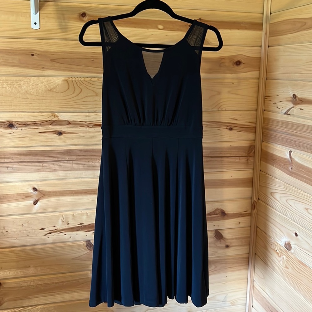 Cute little black dress. Size 4. Loop for button closure needs to be sewn.